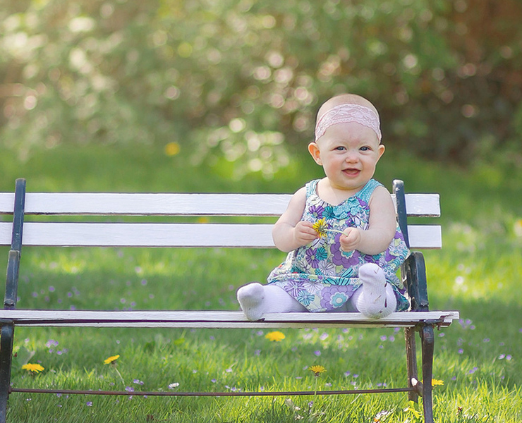 baby sitting on bench
